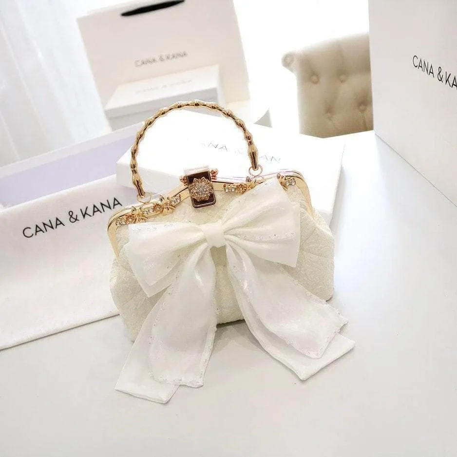 Large Bow Detailed Shimmery Top Handle Purse
