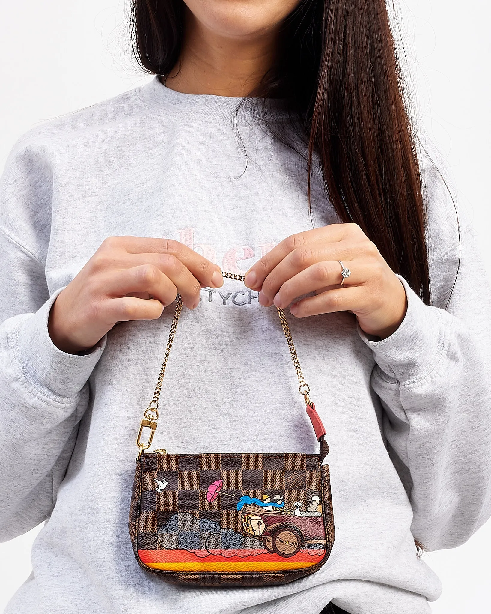 Louis Vuitton Monogram Canvas Illustre Evasion Mini Pochette Accessoires