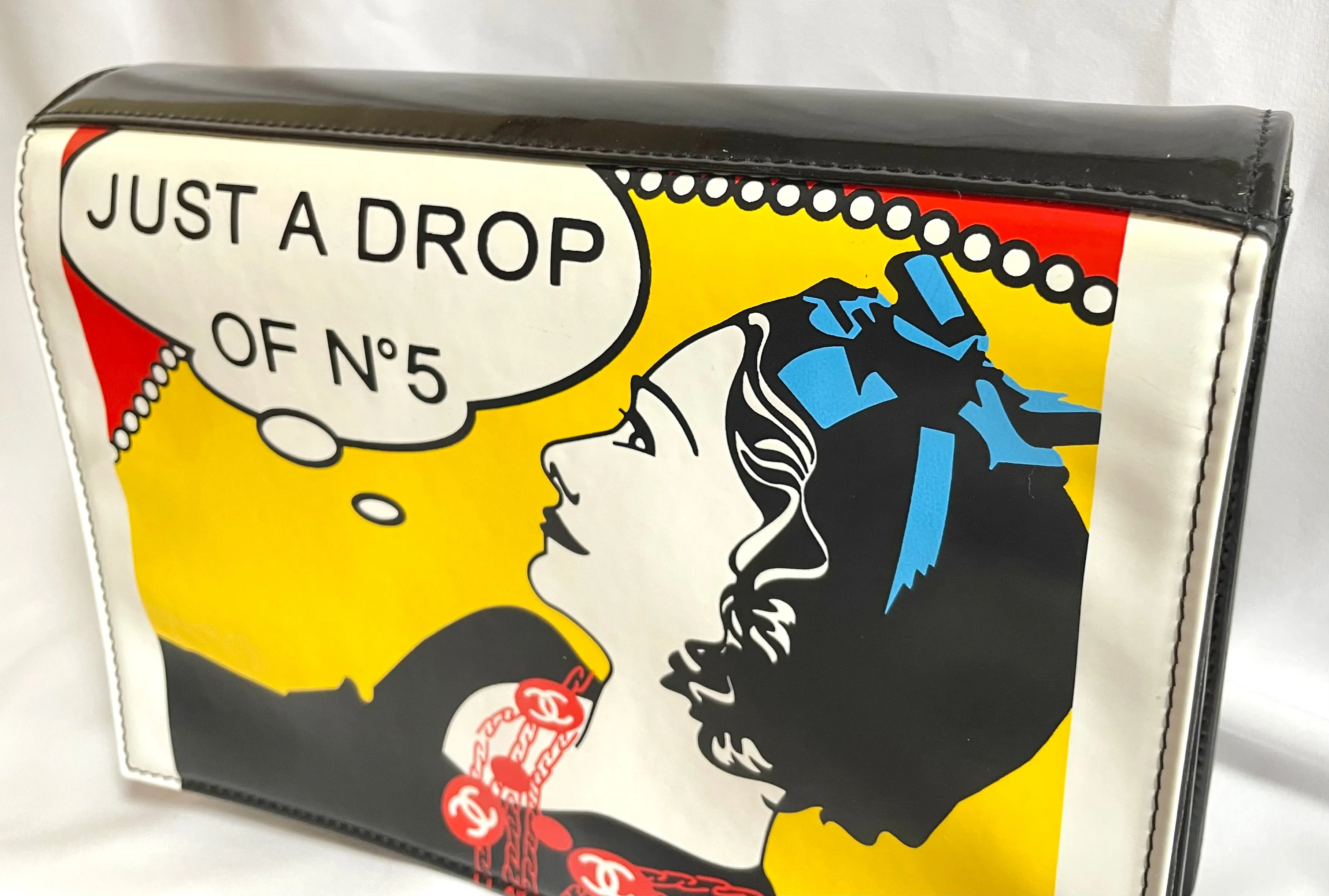 Vintage CHANEL patent enamel clutch bag, wristlet in mademoiselle portrait, Just a drop of Number 5, in black, yellow, and red.  050907rk1