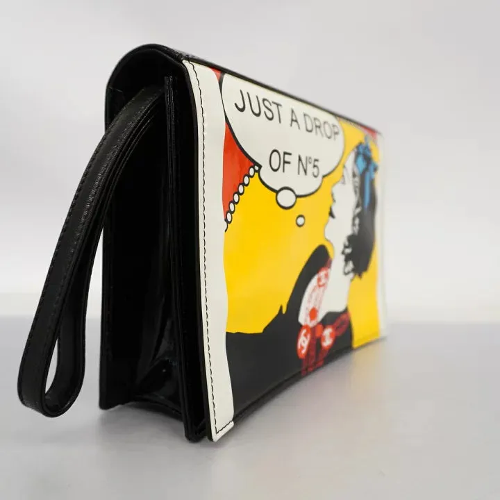Vintage CHANEL patent enamel clutch bag, wristlet in mademoiselle portrait, Just a drop of Number 5, in black, yellow, and red.  050907rk1